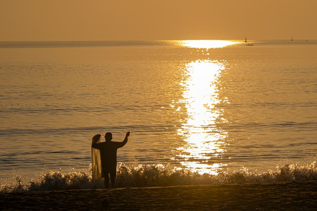 fisherman casting net
