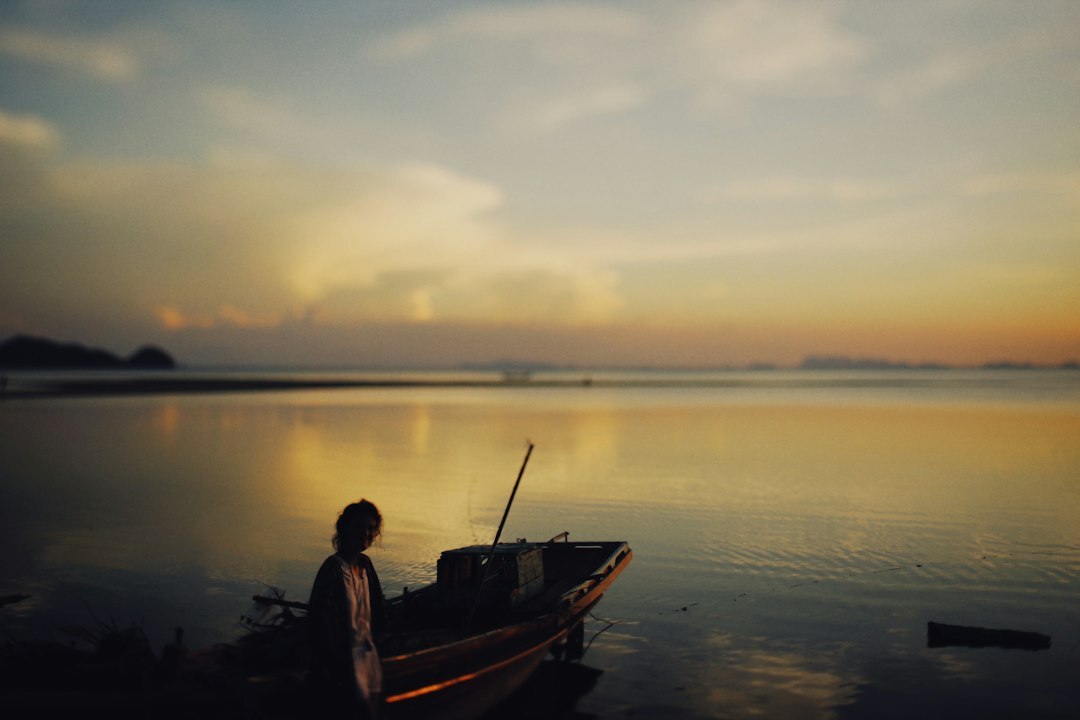fisherman preparing boat at dawn